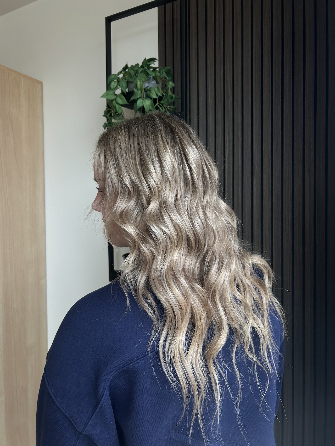 Long blonde balayage with hand-tied extensions at Fringe Beauty Studio